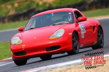 Ross Vincenti's 1998 Porsche Boxster Spec Race Car speeding on track