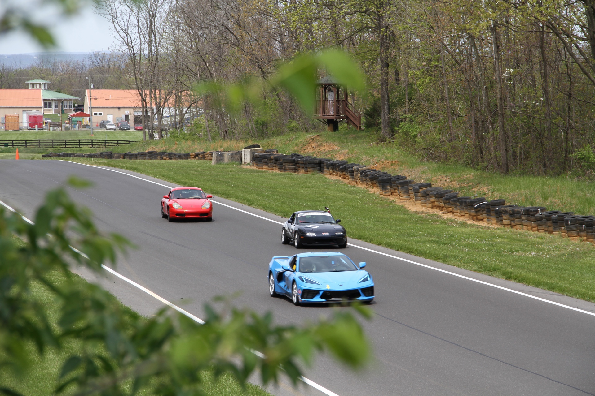 Ross Vincenti's 1998 Porsche Boxster Spec Race Car behind others on road