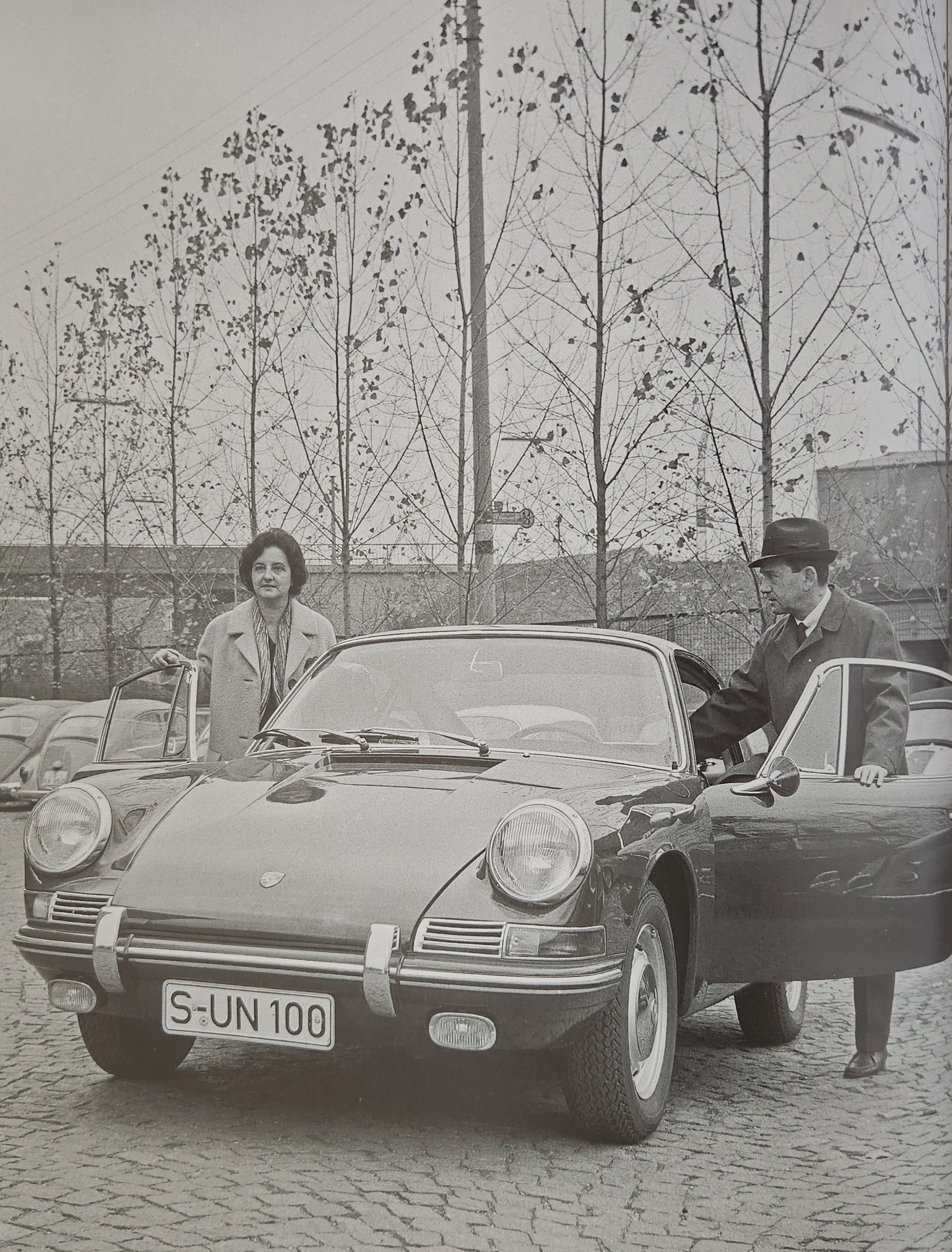 Ferry Porsche and his secretary prepare to test drive the new type 901 in 1964