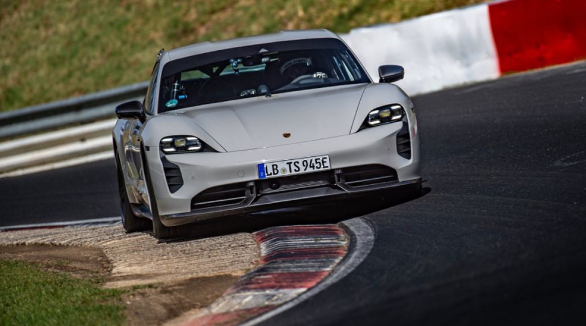 Porsche EV rounding turn on racetrack