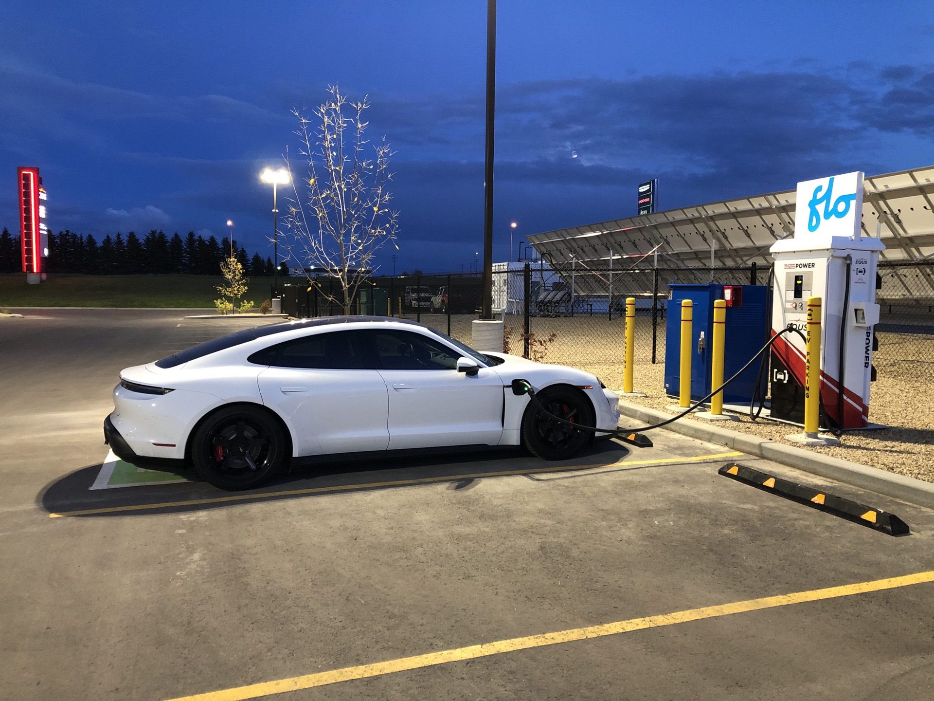 Porsche EV charging in parking lot