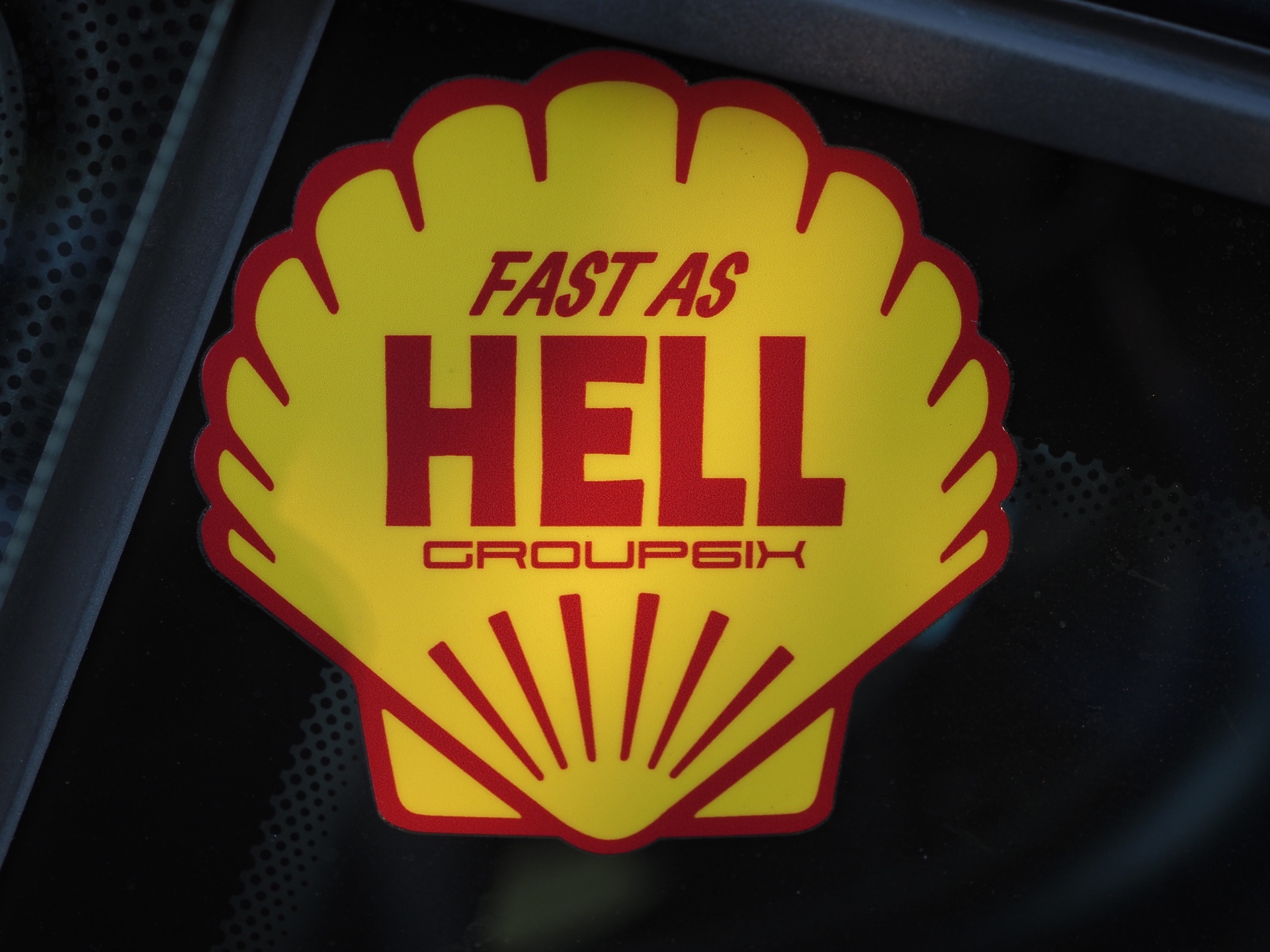 Shell decal with the words Fast As Hell Group Six written on it