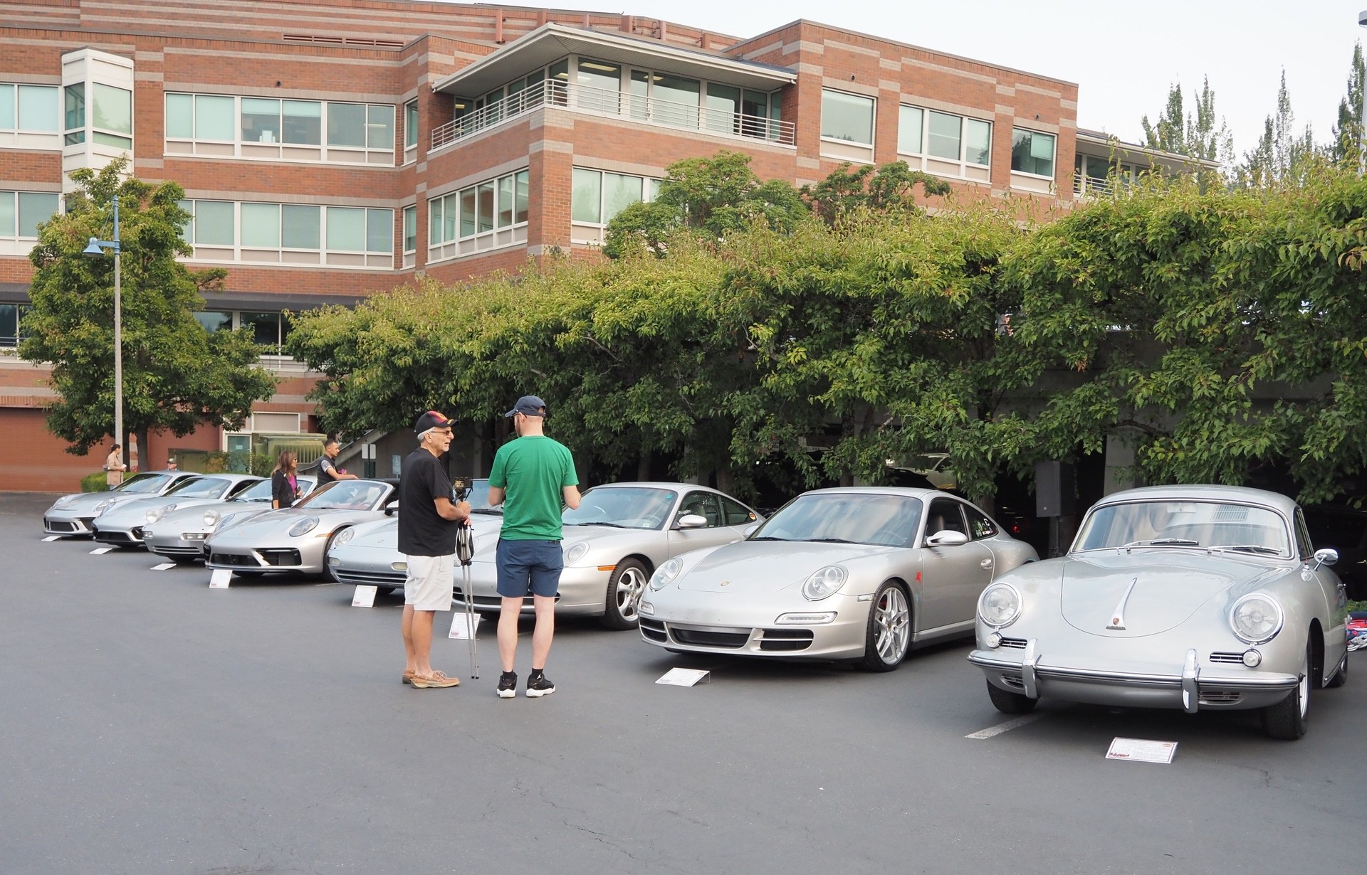 Silver Porsche cars in lot