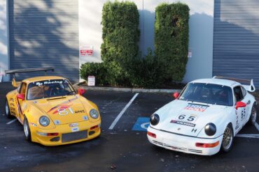 Porsche cars parked in lot