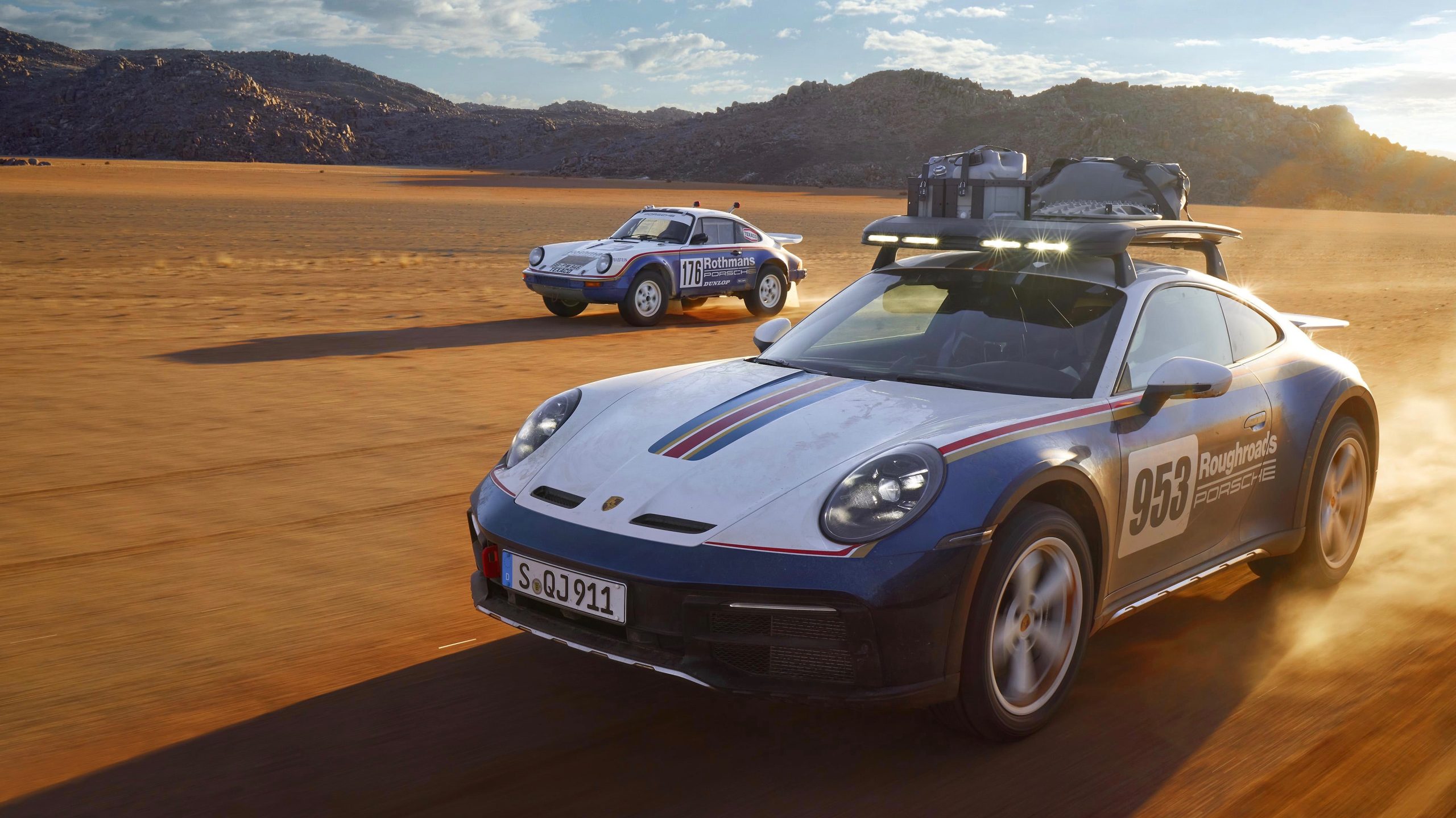 2023 Type 992 Porsche 911 Dakar with a 1984 Type 953 911 Carrera 4x4 RS Rallye in the background