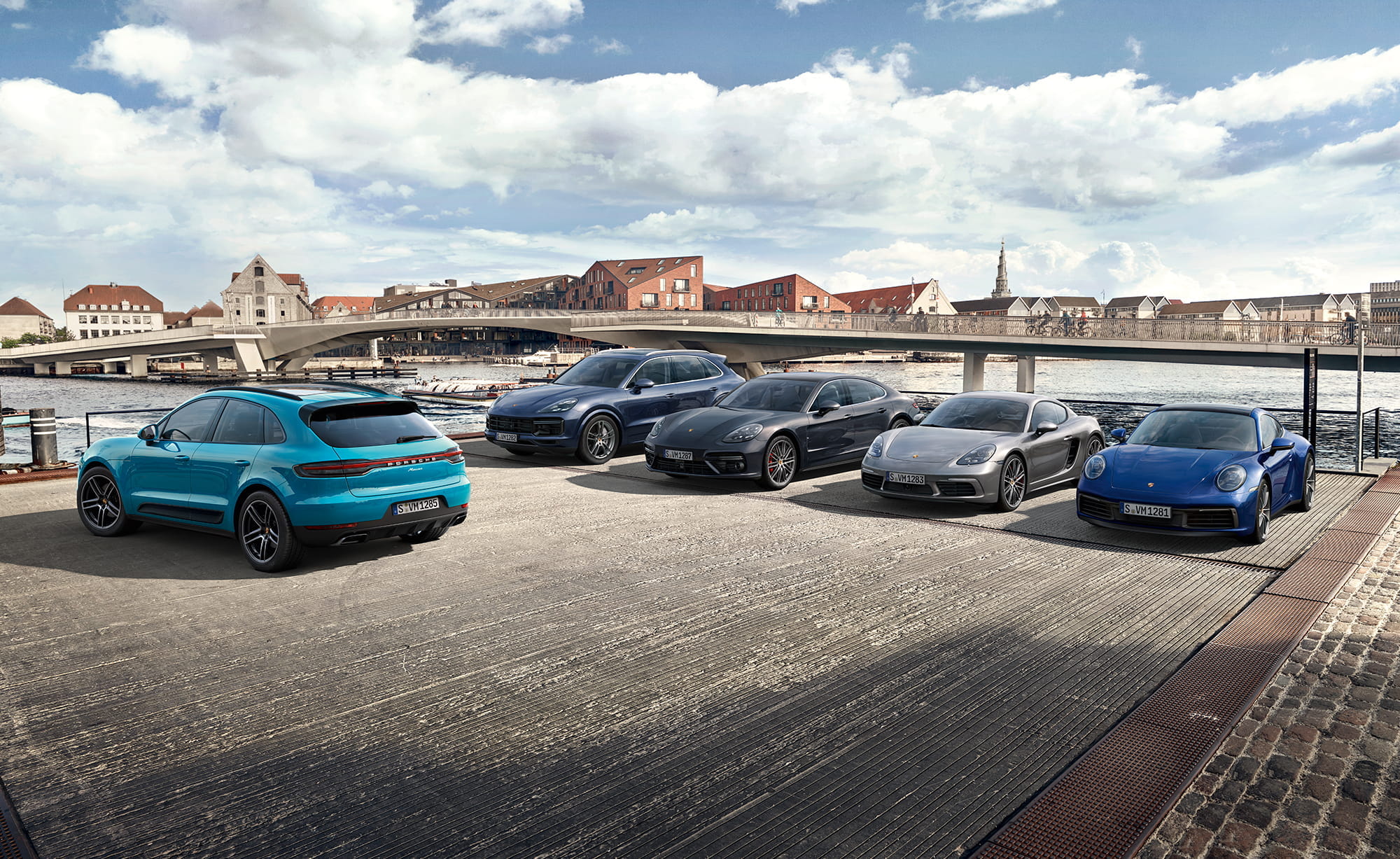 Studio shot of various Porsches outside