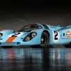 Front-angled view of a Porsche 917 finished with the blue and orange Gulf livery.