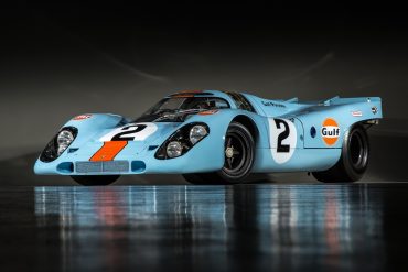 Front-angled view of a Porsche 917 finished with the blue and orange Gulf livery.