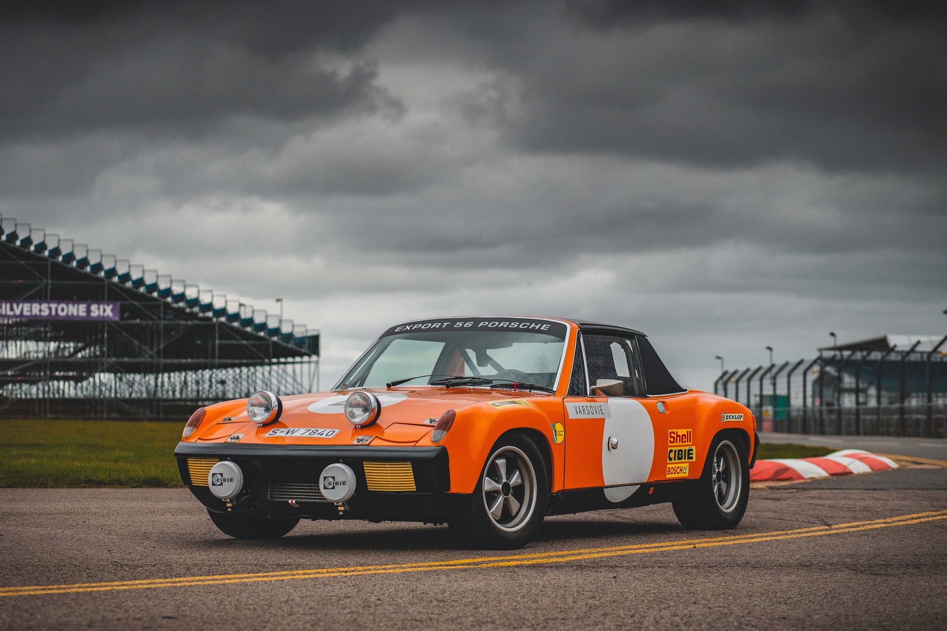 front-angled view of an orange-liveried Porsche 914 /6 GT.