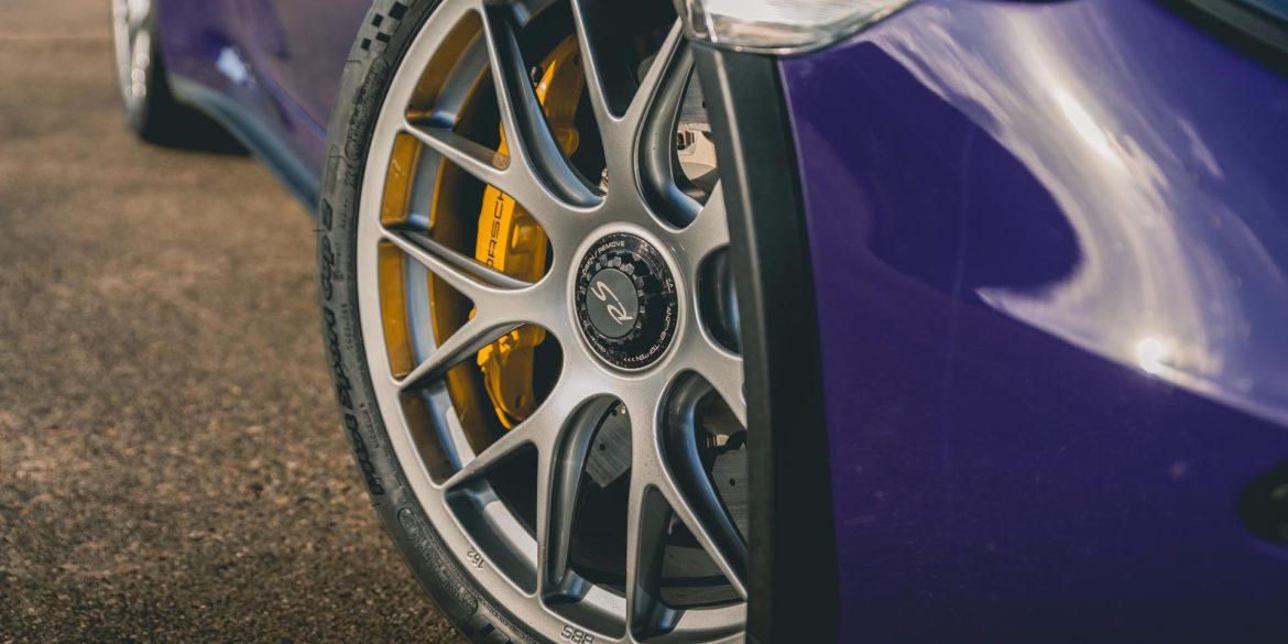 Front wheels on a purple Porsche