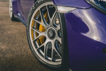 Front wheels on a purple Porsche