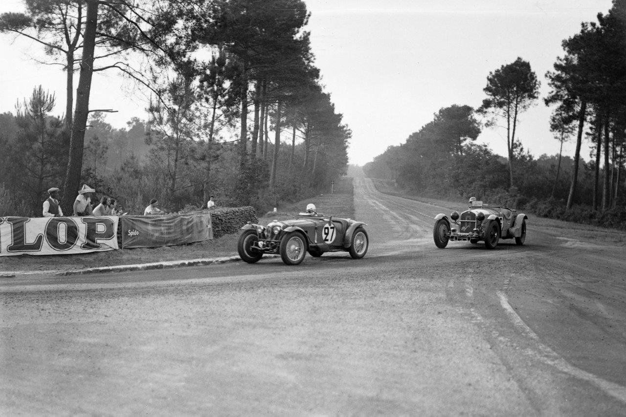 The second place Riley Racing MPH leads an Alfa Romeo at Mulsanne corner in 1934