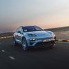 Three-quarter side view of a 2024 blue Porsche Macan Turbo Electric