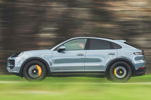 Side view of a 2024 gray Porsche Cayenne GTS Coupe