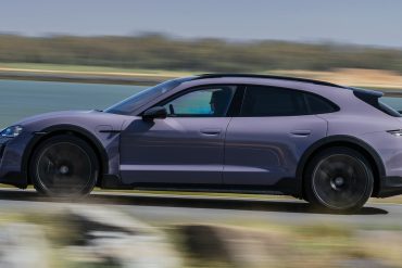 Side view of a 2025 purple Porsche Taycan 4 Cross Turismo