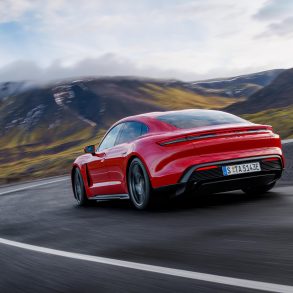 Three-quarter rear view of a 2025 red Porsche Taycan GTS