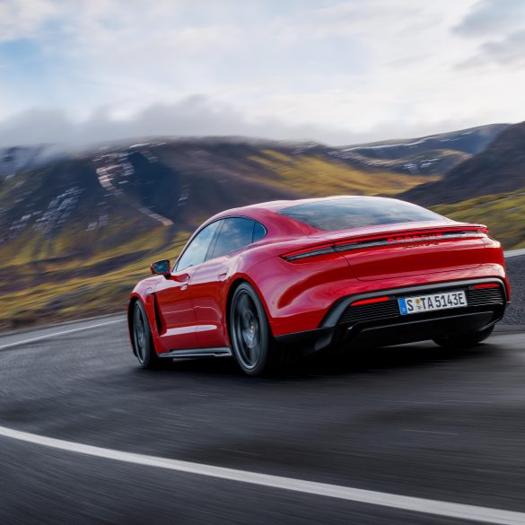 Three-quarter rear view of a 2025 red Porsche Taycan GTS
