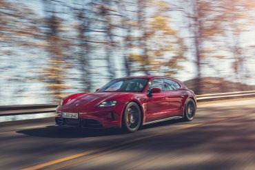 Three-quarter view of a 2025 red Porsche Taycan GTS Sport Turismo