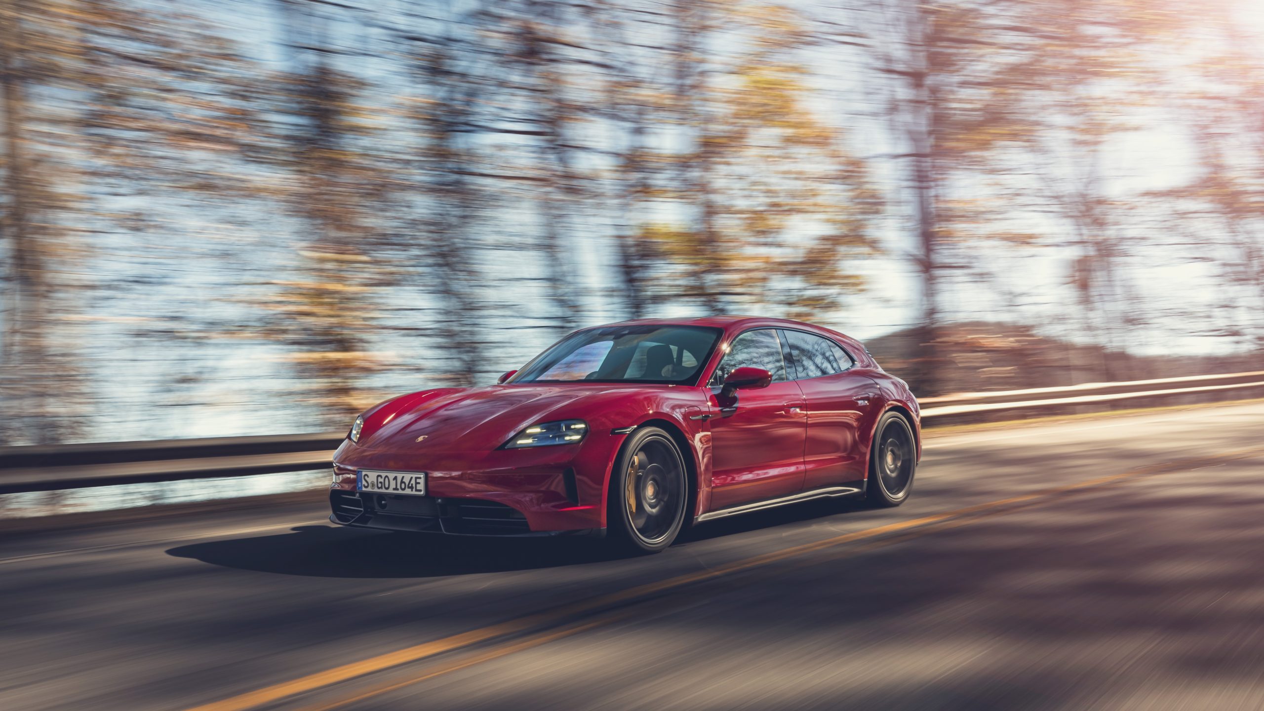 Three-quarter view of a 2025 red Porsche Taycan GTS Sport Turismo