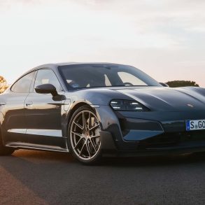 Three-quarter side view of a 2025 gray Porsche Taycan Turbo GT