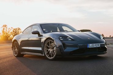 Three-quarter side view of a 2025 gray Porsche Taycan Turbo GT