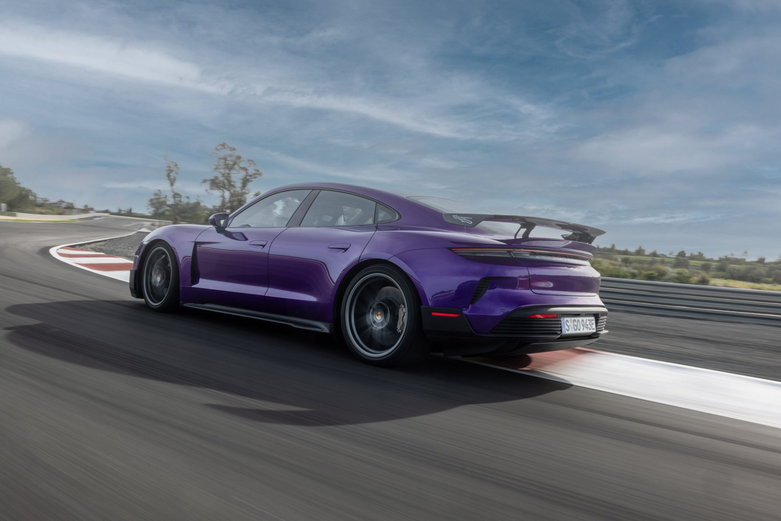 Three-quarter rear view of a 2025 Porsche Taycan Turbo GT with Weissach Package
