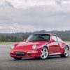 Three-quarter view of a red Porsche 911 Type 993 Carrera 4S