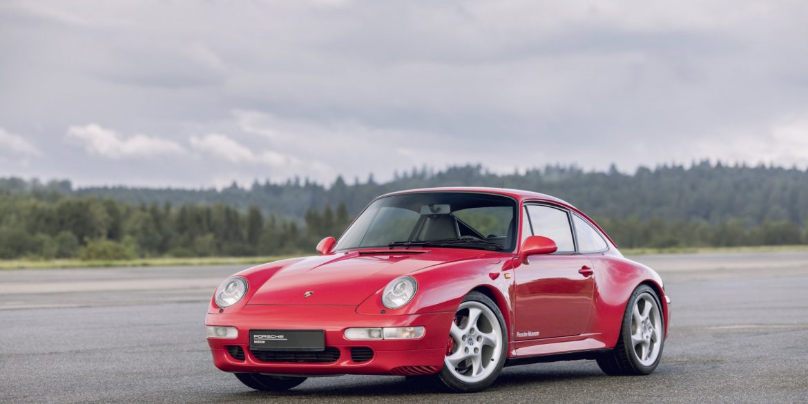 Three-quarter view of a red Porsche 911 Type 993 Carrera 4S