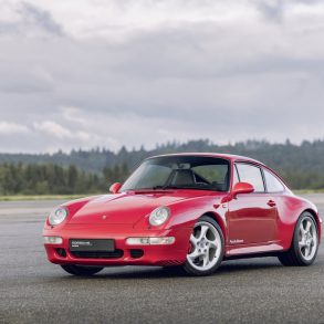 Three-quarter view of a red Porsche 911 Type 993 Carrera 4S