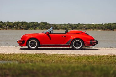 Side view of a 1989 red Porsche 911 Speedster