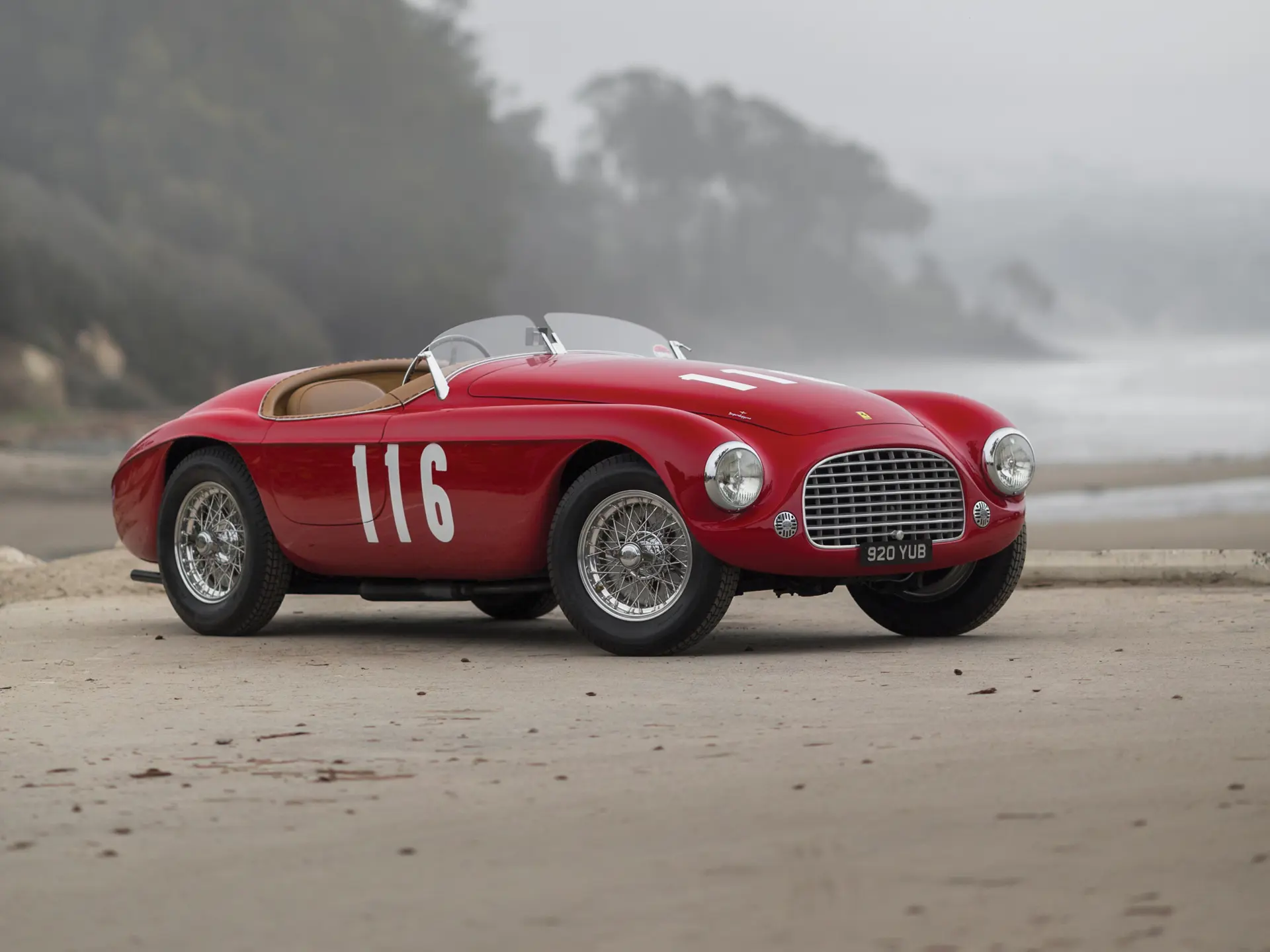 Prior to the debut of the Porsche 550, cars such as the Ferrari 166 MM Barchetta had already established the modern lightweight sports-racing template. The Barchetta combined a compact displacement engine, aluminum bodywork, minimal frontal area, and disciplined mass management to maximize efficiency rather than brute output. Its success demonstrated that balance, chassis composure, and aerodynamic cleanliness could offset larger engines. Porsche internalized these principles. The 550 translated that same engineering logic into a mid-engine configuration, refining the concept with improved weight distribution and structural focus rather than simply replicating Italian form.