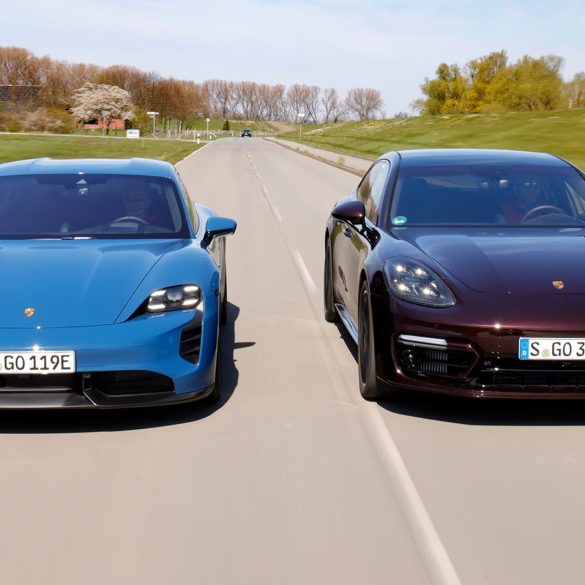 Blue Porsche Taycan and Porsche Panamera side by side on a road