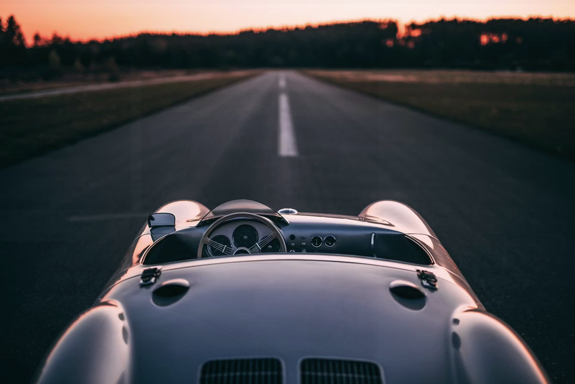 The Porsche 550 still matters because it was the moment Porsche stopped experimenting and started defining itself. It proved that balance could beat brute force, that precision could outlast power — and it carried those lessons forward into every serious machine that followed. The shadow of James Dean ensured it would never live only in paddocks and record books; it entered modern pop culture as both icon and cautionary tale.A small silver Spyder at the edge of an open road — that is where Porsche’s identity truly began.