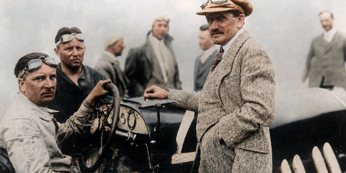 1924 Targa Florio and shows Alfred Neubauer at the wheel with Ferdinand Porsche standing at the right side of the car.