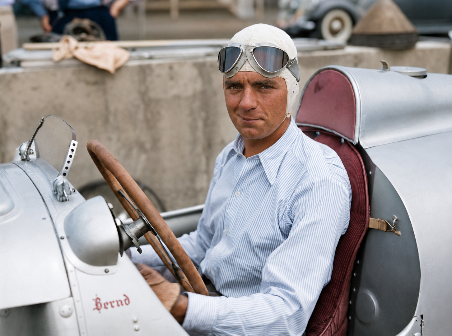 Bernd Rosemeyer (1909–1938) became the driver most closely associated with Auto Union’s fearsome rear-engined Grand Prix cars. Coming from motorcycle racing, he adapted to their unusual balance and violent power delivery with remarkable speed, winning the 1936 European Championship and becoming one of Germany’s most celebrated racing figures. His career ended tragically in January 1938 when he was killed during a high-speed record attempt on the Frankfurt–Darmstadt autobahn.