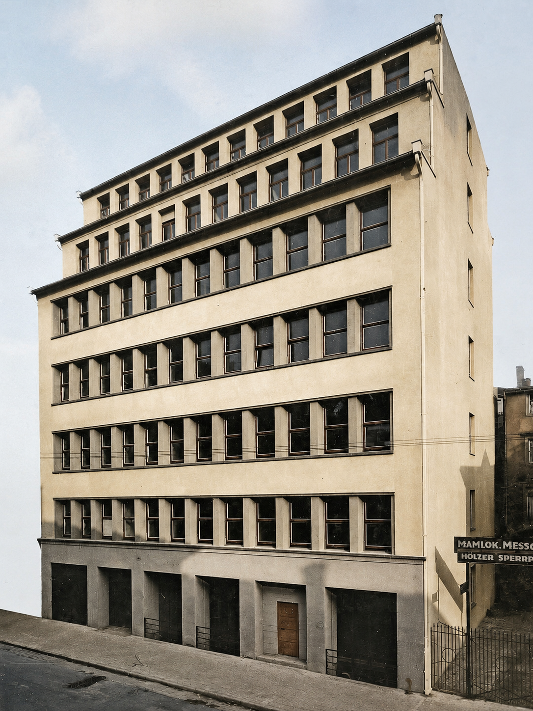 Colorized historical photograph of the 1931 Porsche engineering office at Kronenstraße 24 in Stuttgart, where Ferdinand Porsche founded his independent automotive design and consulting firm.