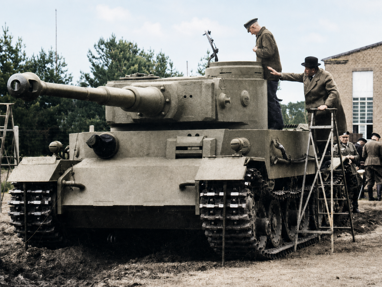 This view of the VK 45.01 (P) during inspection also reveals several problems that extended beyond its unconventional transmission. At nearly 60 tons, the Porsche Tiger placed severe demands on its running gear, steering system, engines, and cooling arrangements, while its relatively short road range and heavy fuel consumption further reduced its usefulness as a mobile battlefield vehicle. Trials indicated that it was less maneuverable than the competing Henschel design, and the underdeveloped power system required frequent maintenance that would have been difficult to provide under field conditions. Porsche’s decision to advance chassis construction before the competition had been settled magnified the consequences: once the design was rejected, Germany was left with dozens of expensive hulls for a tank the army no longer intended to produce. Most were therefore repurposed rather than discarded, turning an unsuccessful heavy-tank program into the foundation for the Ferdinand tank destroyer.