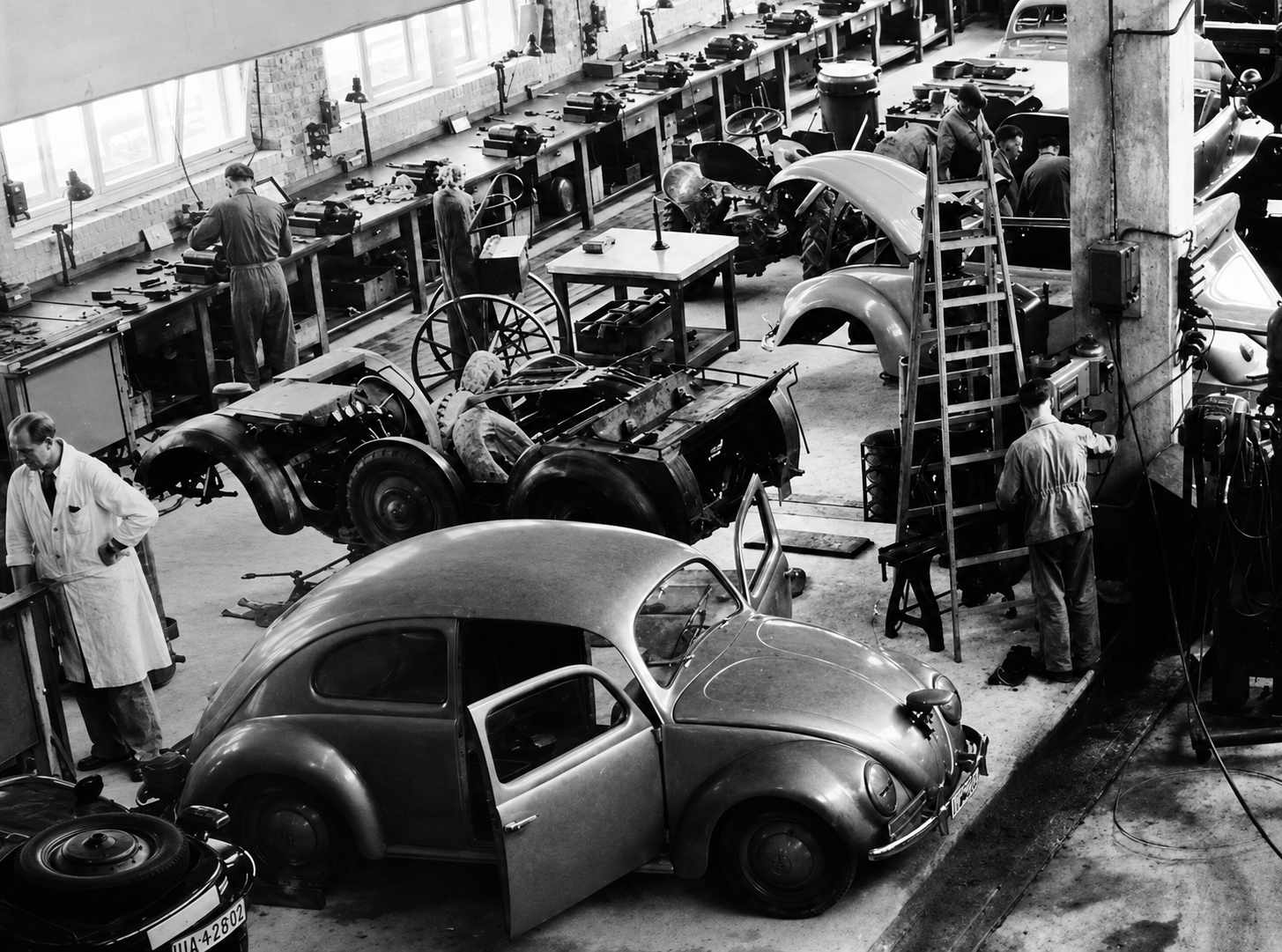 Although the Volkswagen was conceived as a mass-produced automobile in the 1930s, true civilian mass production never fully materialized before the Second World War intervened. Ferdinand Porsche’s Type 60 was engineered specifically for large-scale manufacture, and the massive new factory at Fallersleben was built to produce the KdF-Wagen in numbers the regime claimed would motorize ordinary German families. But while prototypes, test cars, and a limited number of prewar examples were completed, the factory was diverted toward military production before the promised civilian program could be fulfilled. In that sense, the 1930s established the industrial and engineering foundation for Volkswagen mass production, but the dream itself remained largely unrealized until the postwar era.